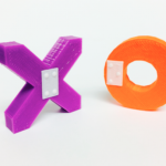 PURPLE "X" AND ORANGE "O" WITH BRAILLE